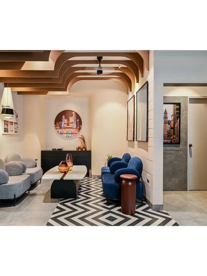 Another view of the reception area, showcasing the interplay of patterns, colors, and the sculptural ceiling fins that define the office's unique design language.