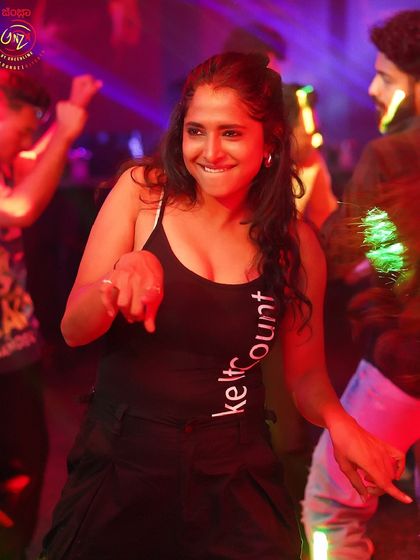 A smiling dancer at the Haunted Mansion party.