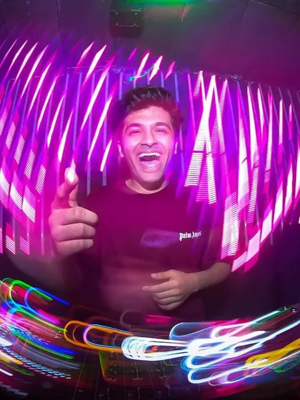 This is me in my element, lost in the music and the lights. This artistic shot captures the dynamic energy and movement of my performance, showing the passion I pour into every single set.