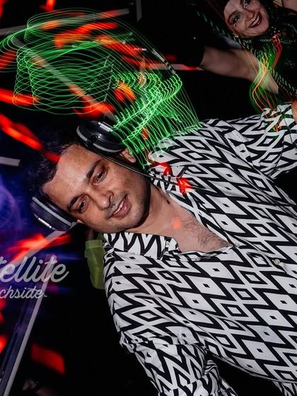 A creative long-exposure shot capturing the movement and light trails during my set. It visually represents the fluid, dynamic nature of the music.