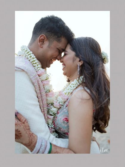 A close-up portrait filled with laughter and affection. The warm sunlight and their joyful expressions make this a perfect shot of a couple truly happy in each other's company.