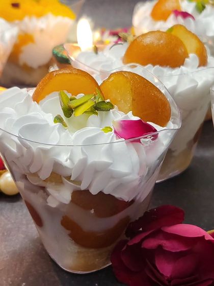 This is my Gulab Jamun Tres Leches, another one of my fusion creations. The soft cake is topped with fluffy cream and juicy gulab jamuns.