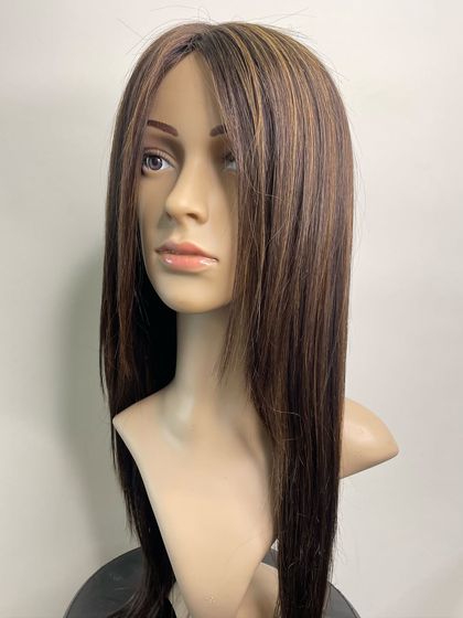 Another angle of our luxurious silk wig, showing how the hair can be styled and how it frames the face naturally.