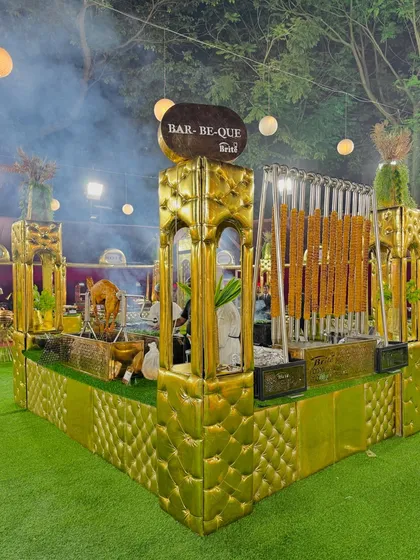 The stunning golden barbecue counter, complete with hanging kebabs, creates a luxurious and inviting focal point.