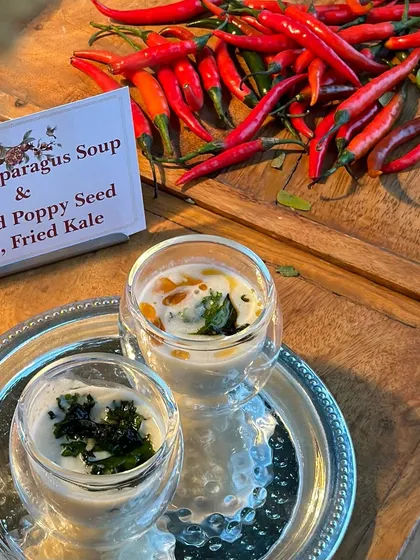 A flavourful explosion on a plate. This flatlay showcases the fresh, vibrant ingredients like red chilies that go into our White Asparagus and Roasted Poppy Seed Soup.