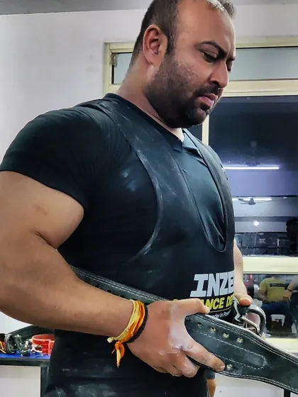 Geared up and focused. Wearing my Inzer deadlift suit and a solid belt is crucial for handling maximum weight safely.