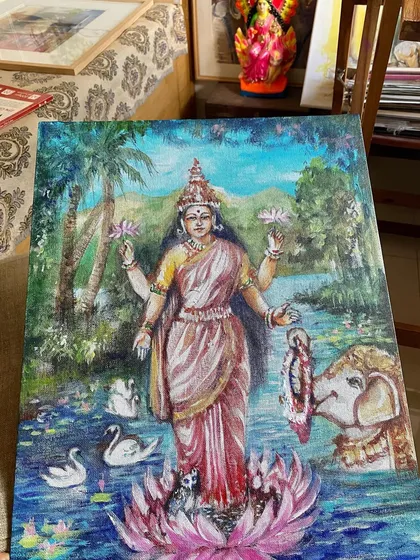 A closer look at my acrylic on canvas painting of Goddess Lakshmi, surrounded by swans and an elephant, standing on a lotus in a lush, natural setting.