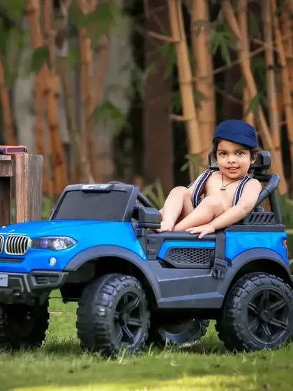 A cool pose from our outdoor garage theme, with the little mechanic looking confident in his ride-on jeep.