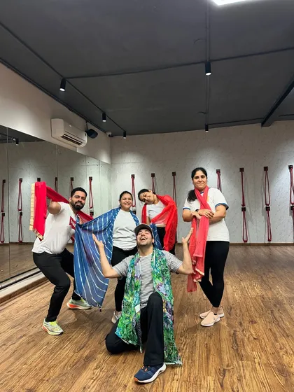 The TGA Fam celebrating Holi with colorful dupattas instead of messy colors.