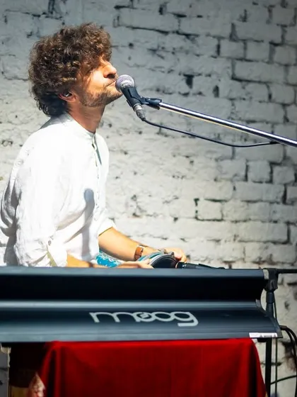 Michael League at the keyboard, with a classic Moog synth. His ability to blend modern electronic sounds with our acoustic setup is a key part of our fusion sound.