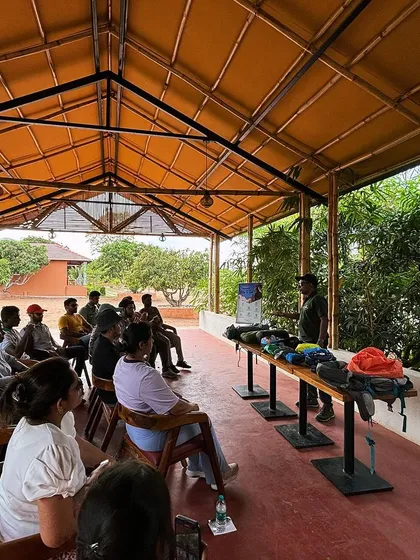 An outdoor classroom session where participants learn about backpacking and essential gear. Our programs combine practical skills training with hands-on adventure for a complete learning experience.