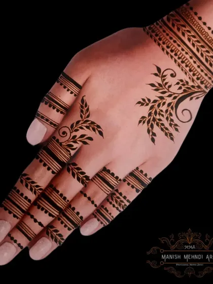 A modern, minimalist design with clean lines and leafy patterns on the fingers and wrist. This style is very chic and contemporary.