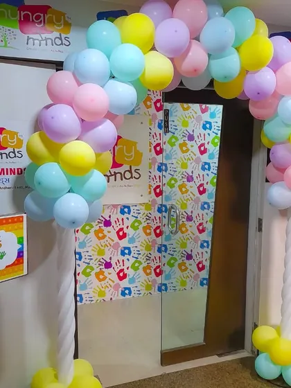 Even a simple entrance can make a big impact. For this kid's party, we created a welcoming pastel balloon arch and a custom sign to greet the guests and set a fun tone from the moment they arrive.