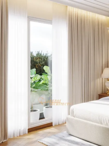 The large window with sheer curtains allows for ample natural light while maintaining privacy, contributing to the room's airy ambiance.