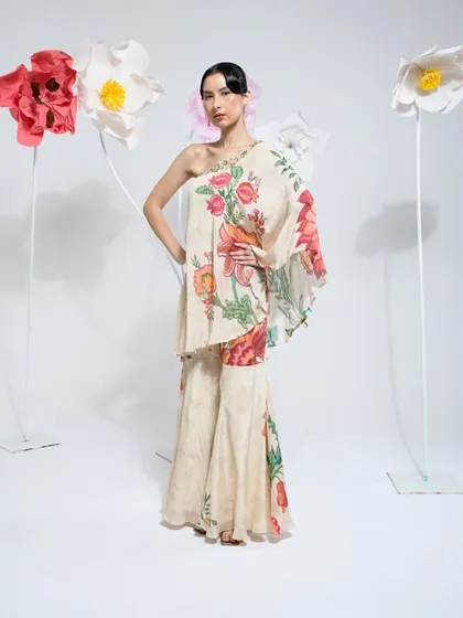 This extensive collection features a wide array of modern festive attire. From vibrant sharara sets and elegant anarkalis to chic jumpsuits and light lehengas, these pieces are curated for wedding guests and anyone looking for a stylish outfit for a special occasion.