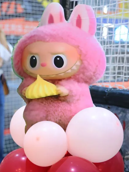A close-up of a cute and quirky Labubu character cutout, one of the many details that bring this unique theme to life.