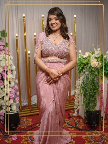 Another view of the beautiful pink draped saree gown, showing how it combines the elegance of a saree with the ease of a gown.