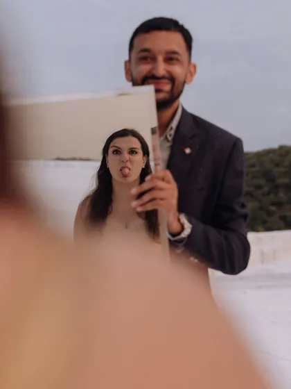 A playful and quirky portrait using a mirror to reflect the bride's fun expression. This shows the couple's personality and my creative approach.
