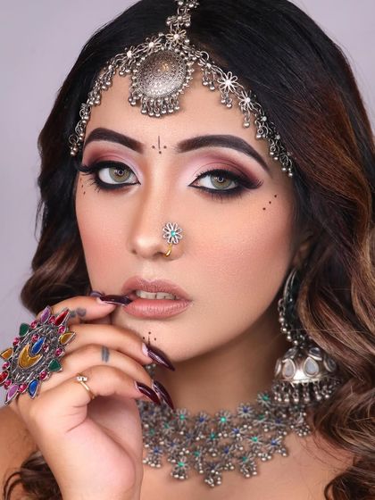 Our boho look is all about freedom and artistry, with smokey eyes, earthy tones, and unique silver jewelry.