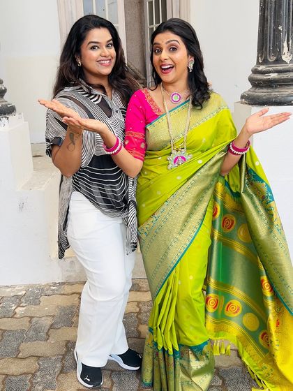 A playful and happy shot with Shivani on set. Her vibrant personality shines through, and the makeup complements her festive look perfectly.