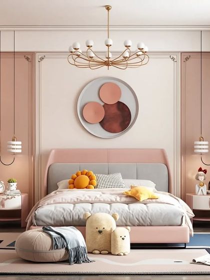 An elegant girl's bedroom in dusty pink tones, with classic wall molding, a stylish wardrobe, and chic lighting fixtures.