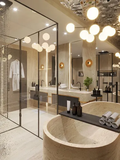 We crafted this master bathroom to feel like a private spa. The design uses travertine stone for the flooring, walls, and freestanding bathtub, creating a monolithic and serene effect. A reflective ceiling and globe lighting add a layer of glamour and warmth.