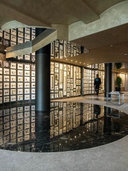 Additional views of the Gala showroom, showcasing the luxurious walk-in closet displays, the reflective marble floor, and the seamless integration of product showcases into the architectural design.