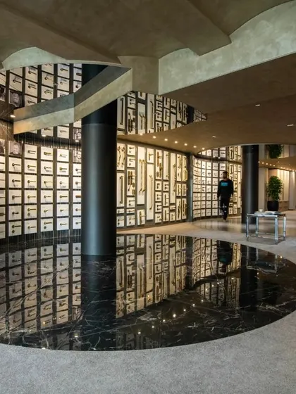 Additional views of the Gala showroom, showcasing the luxurious walk-in closet displays, the reflective marble floor, and the seamless integration of product showcases into the architectural design.