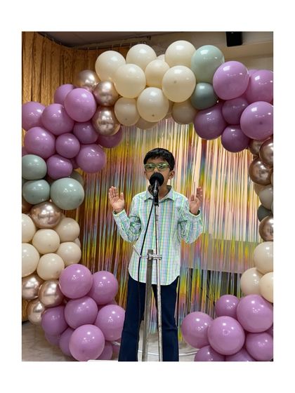 This young speaker addresses the audience with conviction, a result of our focus on building self-assurance and clear communication.