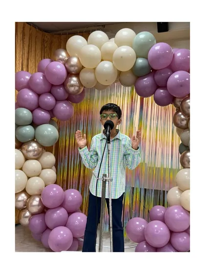 This young speaker addresses the audience with conviction, a result of our focus on building self-assurance and clear communication.