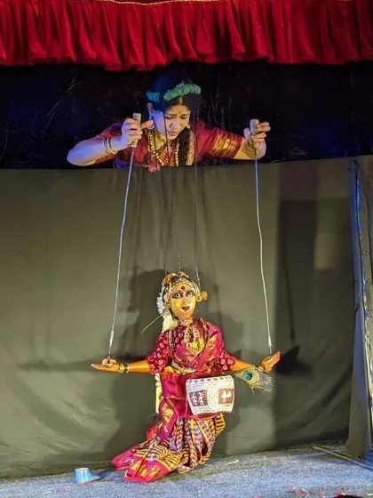 A puppeteer's view from above the stage. This unique perspective shows the skill required to manage the strings of a puppet, ensuring fluid and expressive movements during the performance.