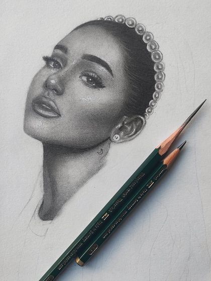 Another angle of the Ariana Grande WIP, with the sharp Faber-Castell pencils I used.
