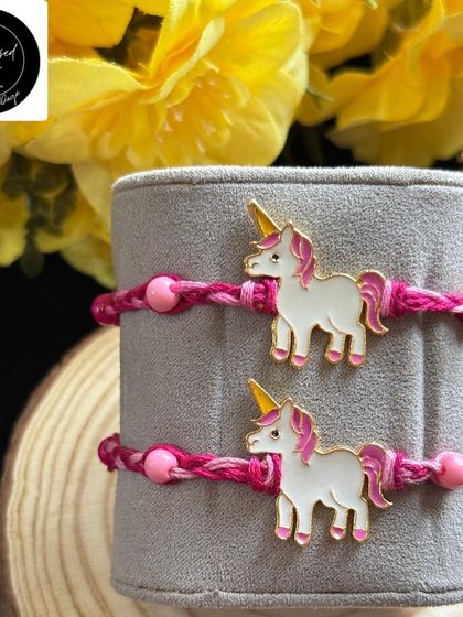 A magical unicorn rakhi for the little dreamer. The cute enamel unicorn charm on a pink braided thread is perfect for celebrating a whimsical bond.