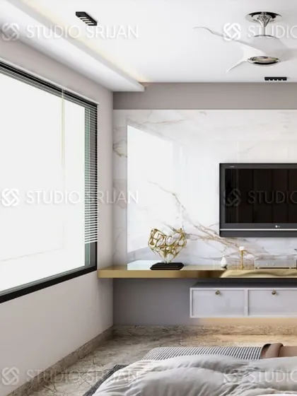 A minimalist TV setup with a floating shelf, set against a clean, white marble wall.