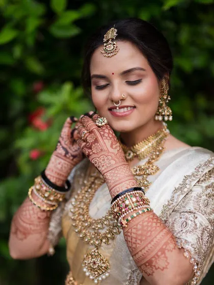 The final look is everything. Here you can see how the rich henna stain complements the bride's stunning wedding attire, adding a layer of tradition and elegance to her special day.