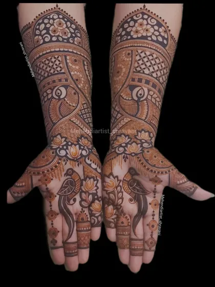 A unique design featuring birds and lotuses on the palms. The forearms are decorated with traditional dome patterns and fine line work.