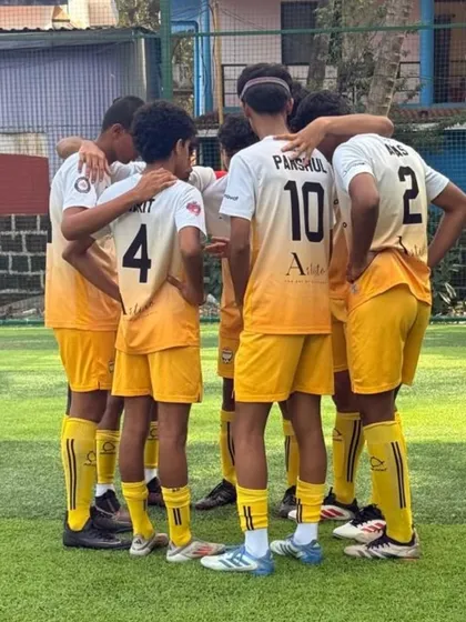 A team huddle before a crucial game, showing the unity and focus of our players.