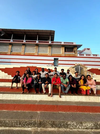 Our group sitting on the steps of a temple ghat during our coastal trip.