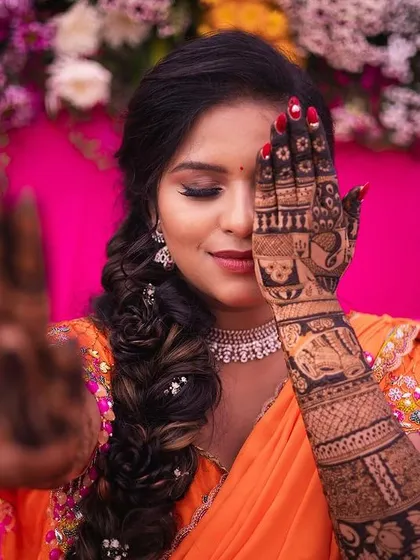 Another view of the artistic peek-a-boo pose, this time with a slightly different angle, showcasing the bride's beautiful eye makeup.