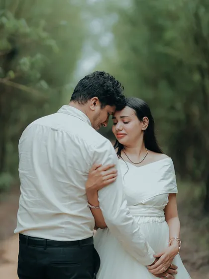 An intimate and emotional portrait of an expecting couple. The simple elegance of the white gown keeps the focus on their connection.