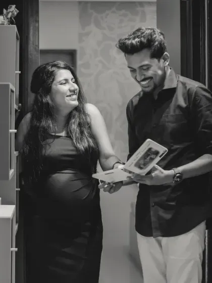Sharing a laugh over old memories or dreams for the future. This candid, black and white shot captures a genuine moment of joy and connection between you.