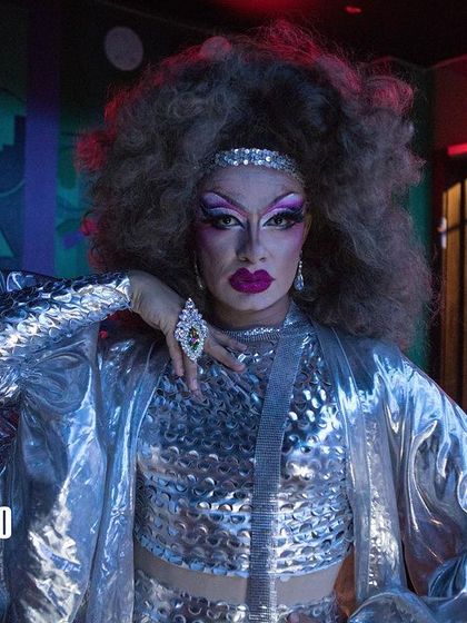 A stunning portrait of a drag performer at Bollywood Disco. My events are a platform for queer artistry and self-expression, celebrating the beauty and power of our community.