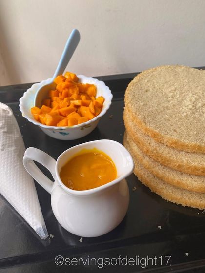 The delicious components of my vegan mango cake: fresh mango puree, chopped mangoes, and light, fluffy vegan sponge layers.
