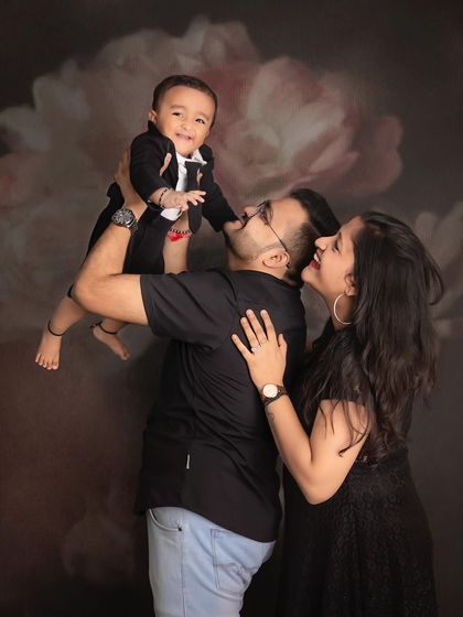 The purest joy in a single photo. This father is lifting his son, and the resulting smiles from the whole family are absolutely priceless.