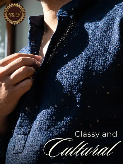 Classy and cultural. A close-up of a navy blue kurta, highlighting its rich texture and sequin details.