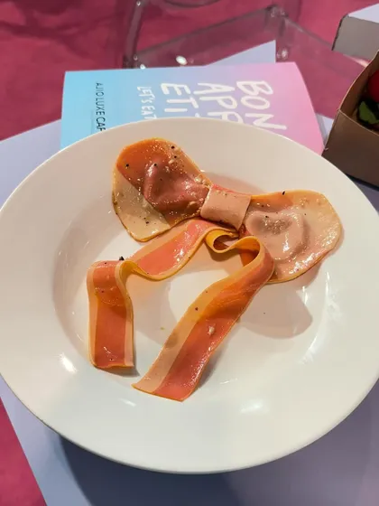 Edible pasta crafted into the shape of a delicate bow, created for a fashion-forward event. This is a perfect example of our playful approach, where even the simplest ingredients are reimagined to fit a creative theme.