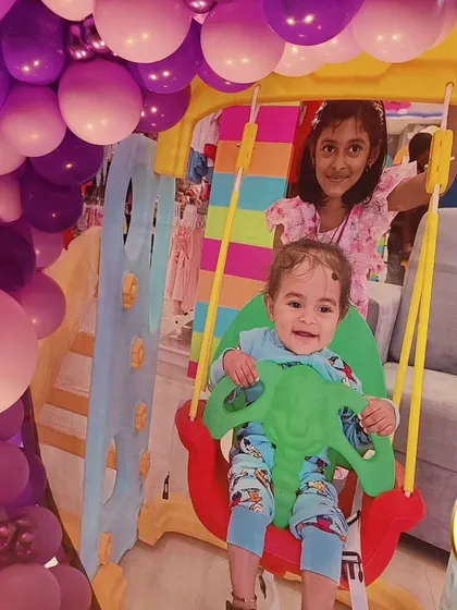 A candid shot of the birthday girls enjoying the princess-themed party.