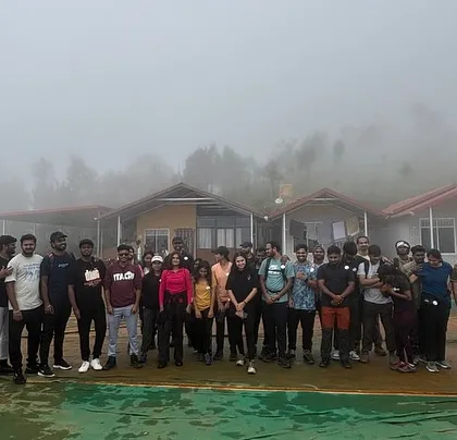 Our group standing outside the foggy homestay before starting the Netravati trek. We arrange comfortable stays on all our weekend trips.