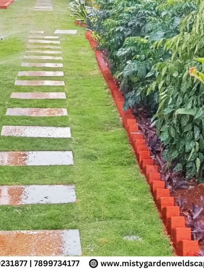 A backyard is a canvas for creating a green sanctuary. For this home in Bommenahalli, we installed a lush natural lawn, laid elegant stepping stones to create a clean pathway, and designed a multi-layered plantation that adds depth and vibrancy to the entire space.