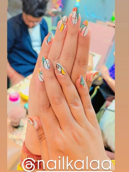 A modern, abstract design inspired by Picasso, with geometric shapes and lines in various colors on a white base.